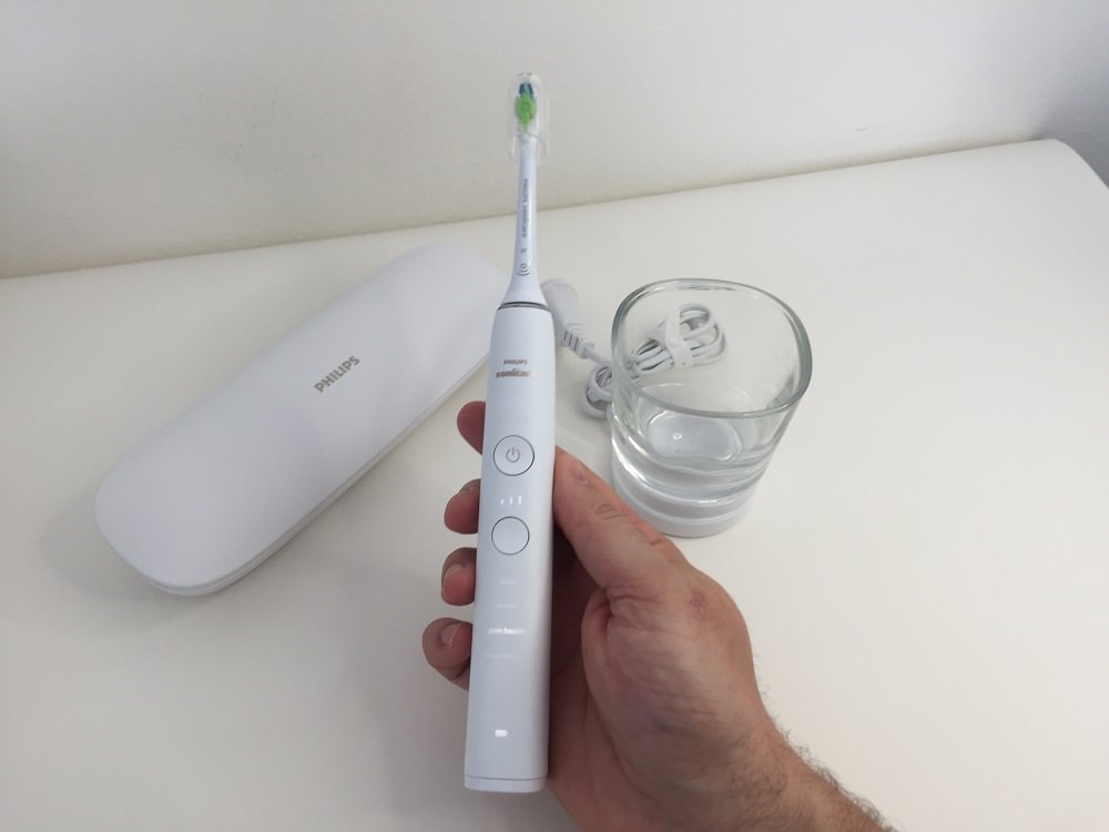 Holding the Philips DiamondClean 9000 Electric Toothbrush