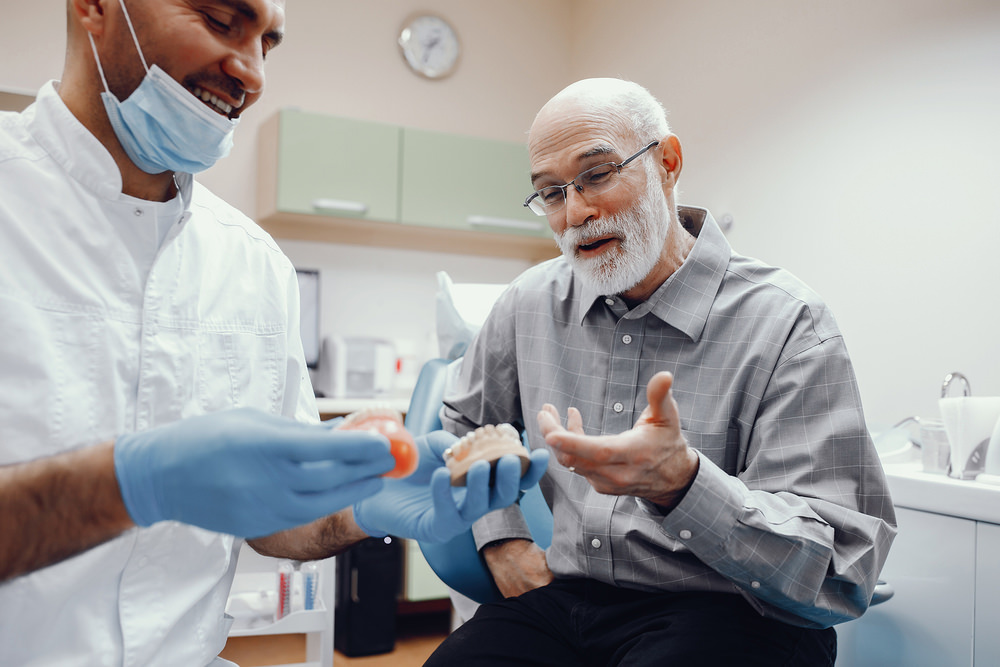 A man getting new dentures