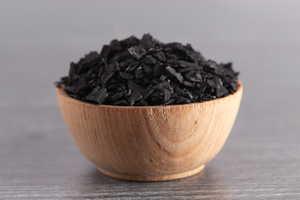 Activated charcoal in a cup