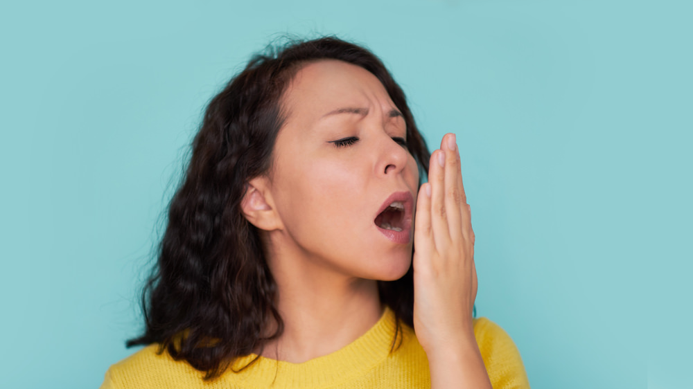 A lady checking her breath