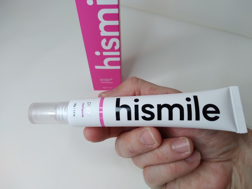 holding hismile PAP+ toothpaste
