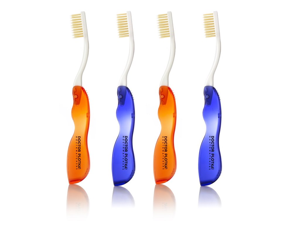 Orange and blue travel toothbrushes by Mouthwatchers